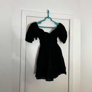 Black mini babydoll dress with puffed sleeves
Size Small
In great condition